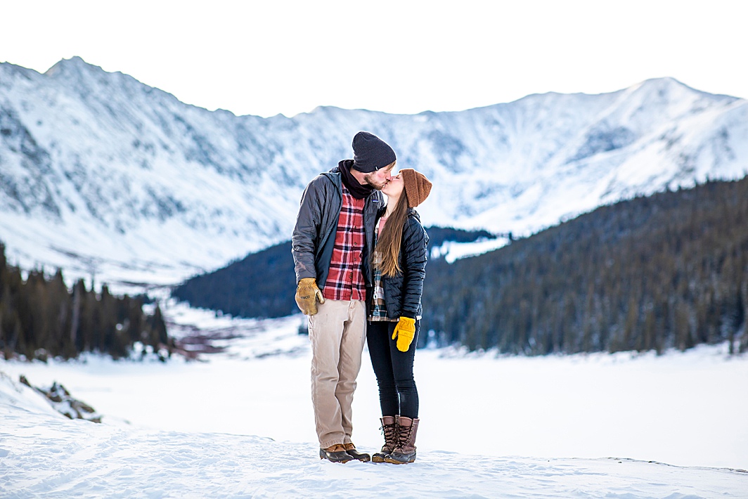 Engaged couple kisses in Breckenridge, Colorado by Colorado Wedding Photographer Hillary Shedd Photography