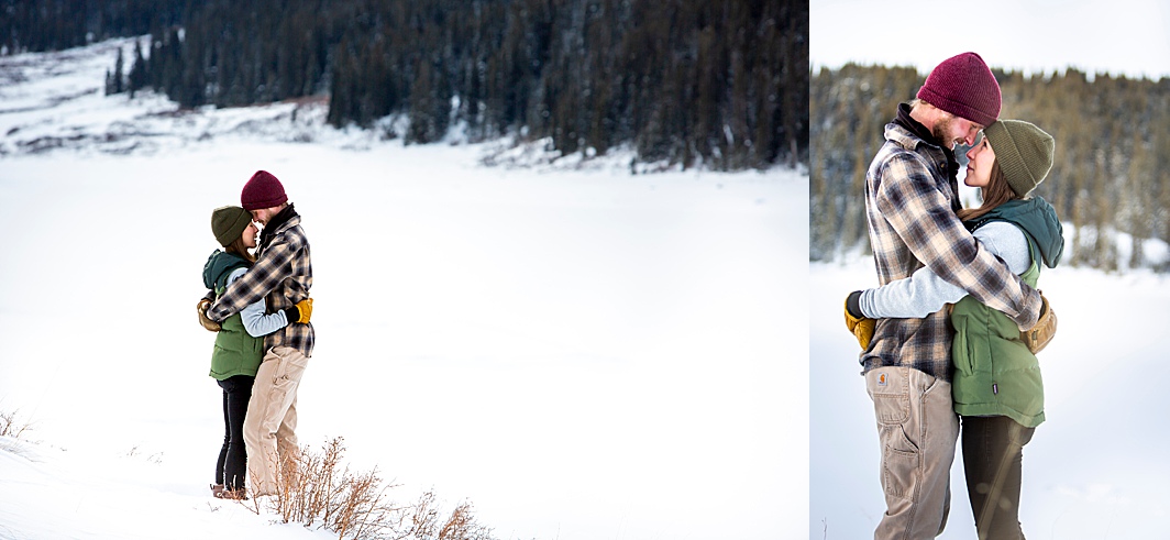 Couple embraces during their cute winter engagement session in Colorado with Hillary Shedd Photography.